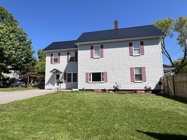 60 Elm St, Bangor, ME 04401 - back of property featuring a chimney, metal roof, and a pergola