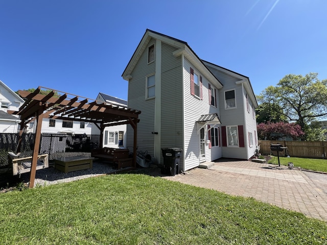 60 Elm St, Bangor, ME 04401 - back of property with a pergola and a patio area