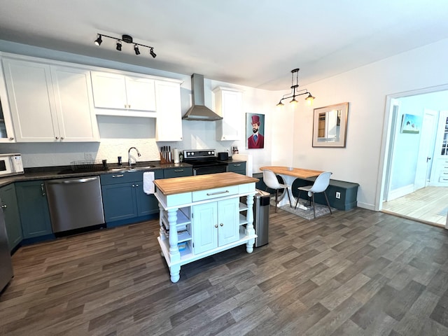 60 Elm St, Bangor, ME 04401 - kitchen featuring stainless steel dishwasher, wall chimney exhaust hood, wood counters, open shelves, and black range with electric stovetop