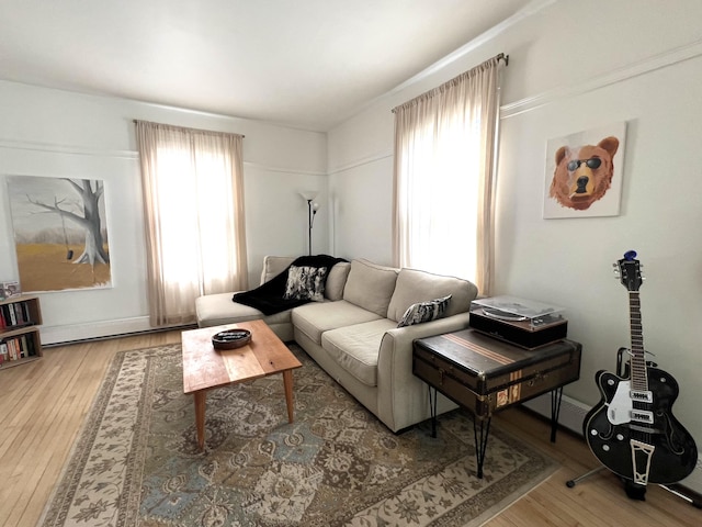 60 Elm St, Bangor, ME 04401 - living room featuring wood finished floors and baseboard heating