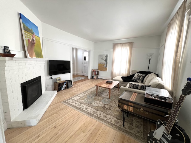 60 Elm St, Bangor, ME 04401 - living area with hardwood / wood-style flooring and a fireplace