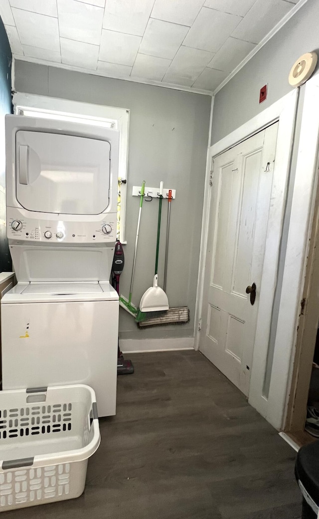 60 Elm St, Bangor, ME 04401 - washroom with stacked washer / dryer, wood finished floors, and baseboards