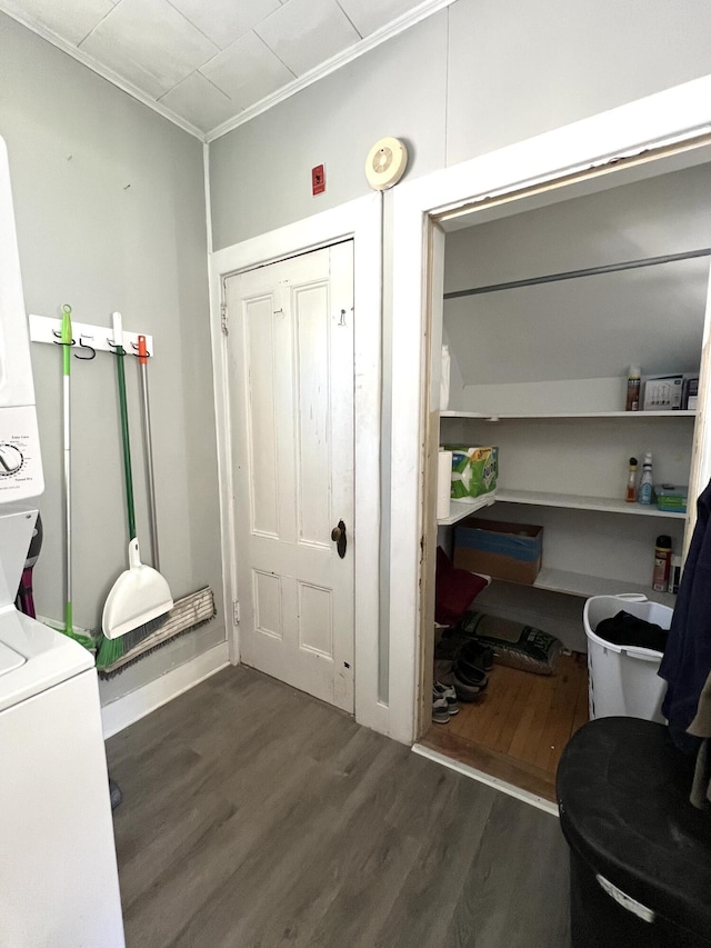 60 Elm St, Bangor, ME 04401 - laundry room featuring stacked washer and clothes dryer and wood finished floors