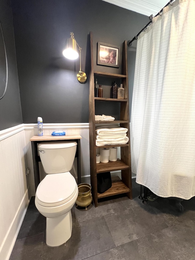 60 Elm St, Bangor, ME 04401 - bathroom with a wainscoted wall, toilet, and curtained shower