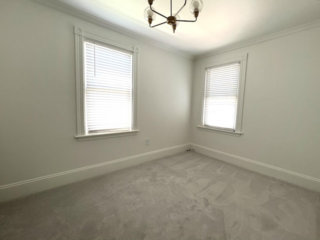 60 Elm St, Bangor, ME 04401 - spare room with a chandelier, ornamental molding, light carpet, and baseboards