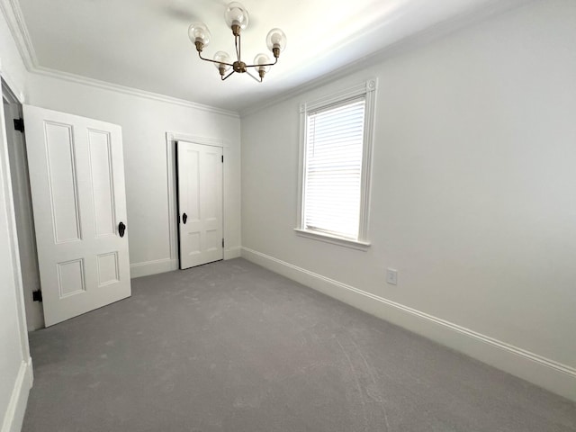 60 Elm St, Bangor, ME 04401 - unfurnished bedroom featuring crown molding, a chandelier, carpet, a closet, and baseboards