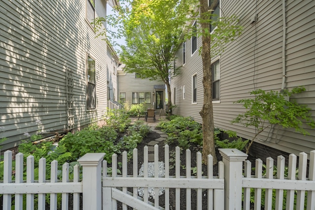 15 Obrion St Unit A, Portland, ME 04101 - view of side of property featuring a fenced front yard and a gate