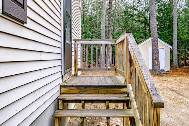 deck with an outdoor structure and a storage shed