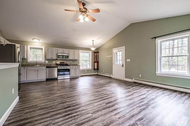 kitchen featuring a baseboard heating unit, a baseboard radiator, dark wood-style floors, and stainless steel appliances