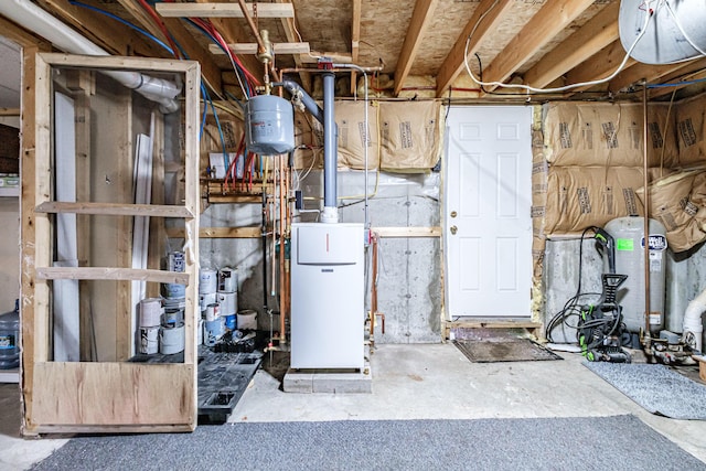 unfinished below grade area with water heater and a heating unit