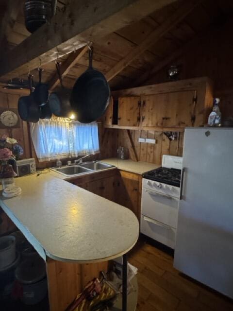 77 Orchard Dr, Saint Albans, ME 04971 - kitchen featuring dark wood-style flooring, a sink, light countertops, lofted ceiling, and white appliances