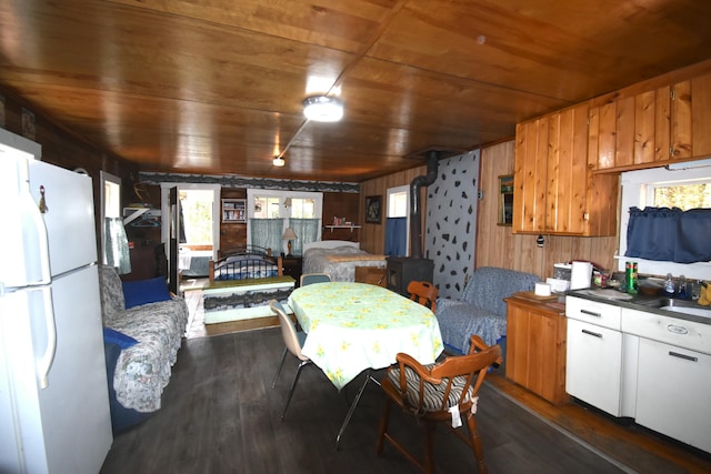 78 Martin Rd, Saint Albans, ME 04971 - kitchen with dark wood-style flooring, a healthy amount of sunlight, wooden walls, wood ceiling, and freestanding refrigerator