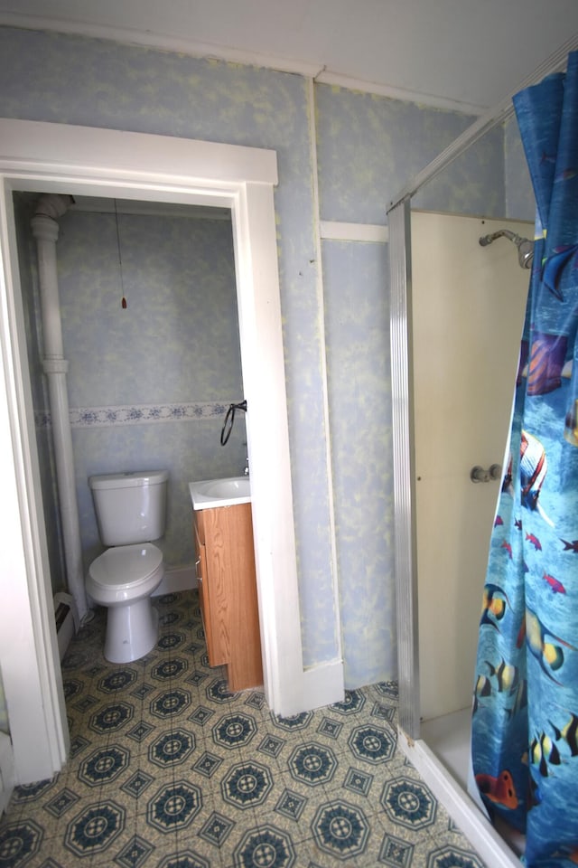 131 George St, Pittsfield, ME 04967 - full bath with vanity, toilet, a stall shower, and wallpapered walls