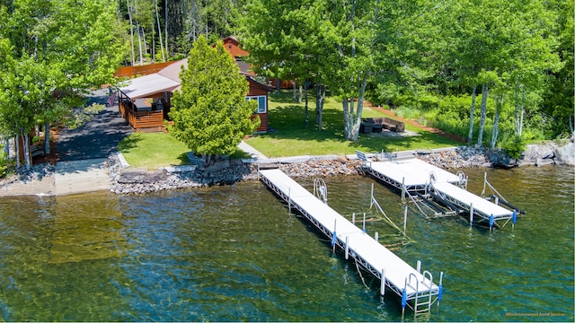 28 Valentine Ln, Dexter, ME 04930 - dock with boat lift, a lawn, and a water view
