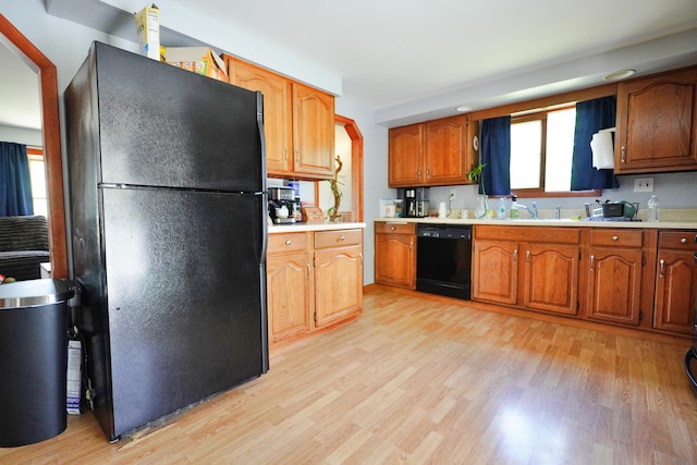 845 Hudson Rd, Glenburn, ME 04401 - kitchen featuring black appliances, light wood-type flooring, and light countertops