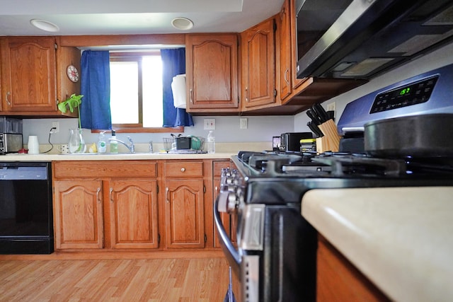 845 Hudson Rd, Glenburn, ME 04401 - kitchen with dishwasher, brown cabinets, and light countertops