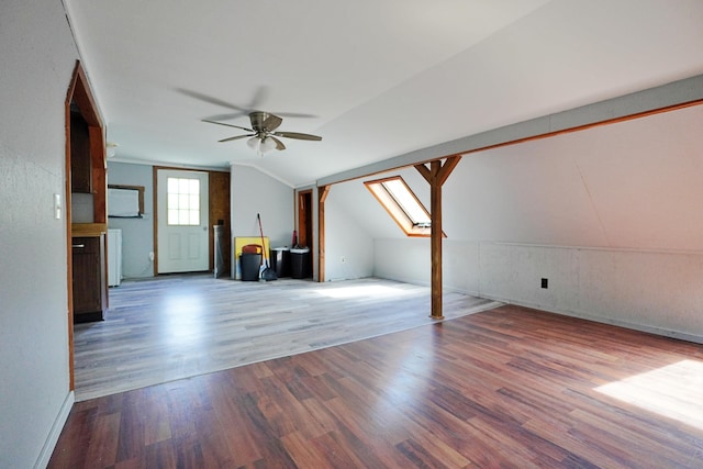 845 Hudson Rd, Glenburn, ME 04401 - additional living space with wood finished floors, a ceiling fan, lofted ceiling, baseboards, and a skylight