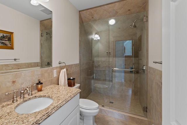 56 Deans Way, Cumberland, ME 04110 - full bathroom featuring toilet, vanity, tile walls, and a shower stall