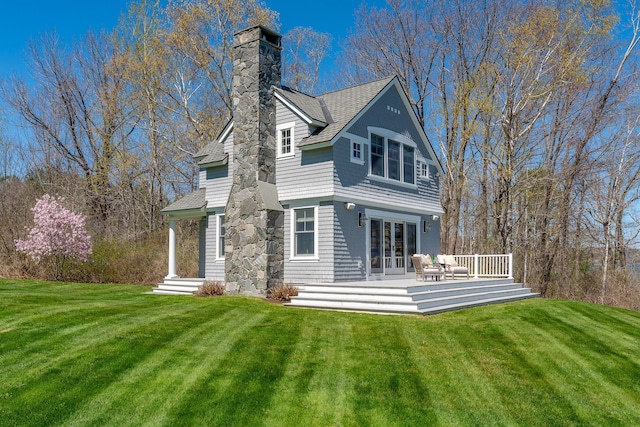 56 Deans Way, Cumberland, ME 04110 - rear view of property featuring french doors, a yard, a chimney, and a deck