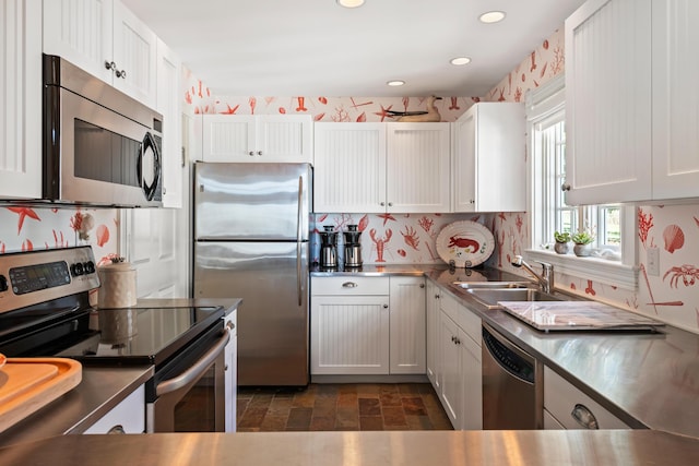56 Deans Way, Cumberland, ME 04110 - kitchen with a sink, stainless steel appliances, recessed lighting, white cabinetry, and stainless steel countertops