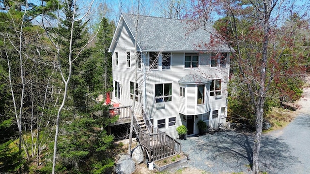 7 N Star Ln, Sullivan, ME 04664 - view of front of home featuring roof with shingles, a deck, and stairway