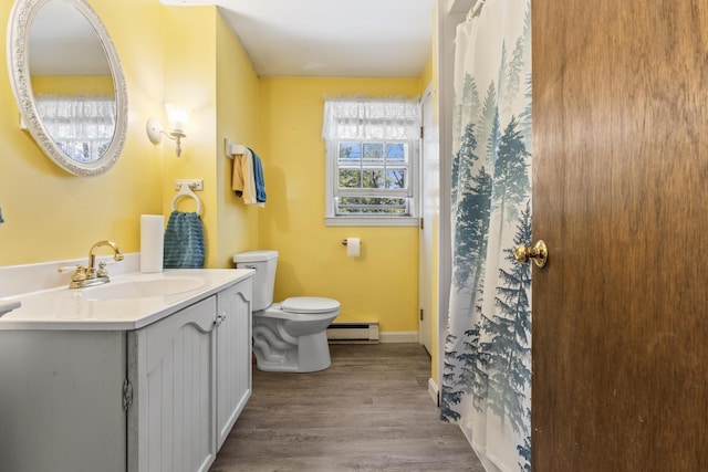 full bathroom with toilet, baseboards, wood finished floors, vanity, and a baseboard radiator