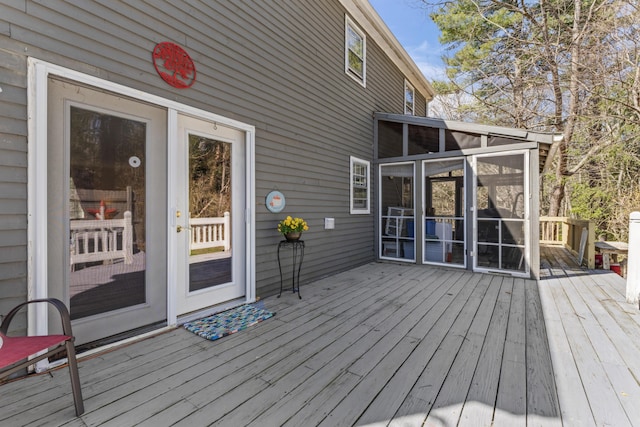 deck with a sunroom