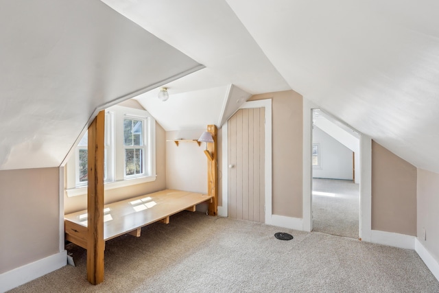 bonus room featuring vaulted ceiling, baseboards, and carpet floors