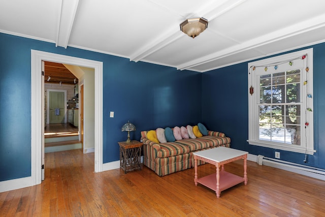 40 Mountain St, Camden, ME 04843 - living room featuring beamed ceiling, baseboard heating, baseboards, and wood-type flooring