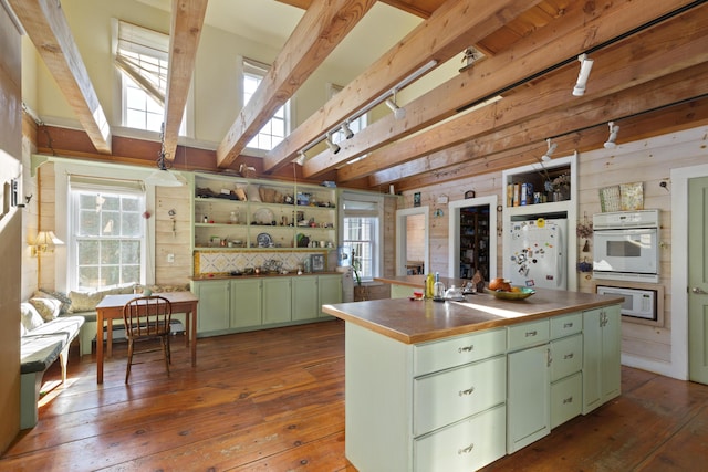 40 Mountain St, Camden, ME 04843 - kitchen with dark wood-style floors, green cabinetry, open shelves, white appliances, and a center island