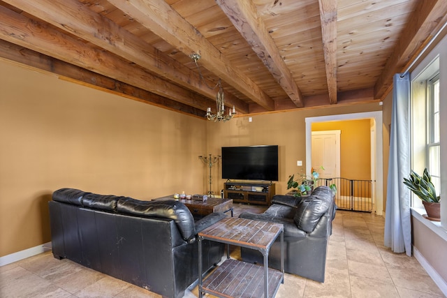 40 Mountain St, Camden, ME 04843 - living room featuring beamed ceiling, baseboards, wood ceiling, and an inviting chandelier