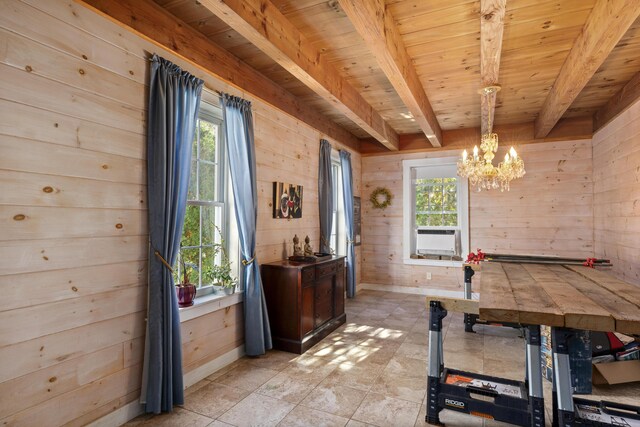 40 Mountain St, Camden, ME 04843 - dining room with a chandelier, beam ceiling, wood walls, and a healthy amount of sunlight
