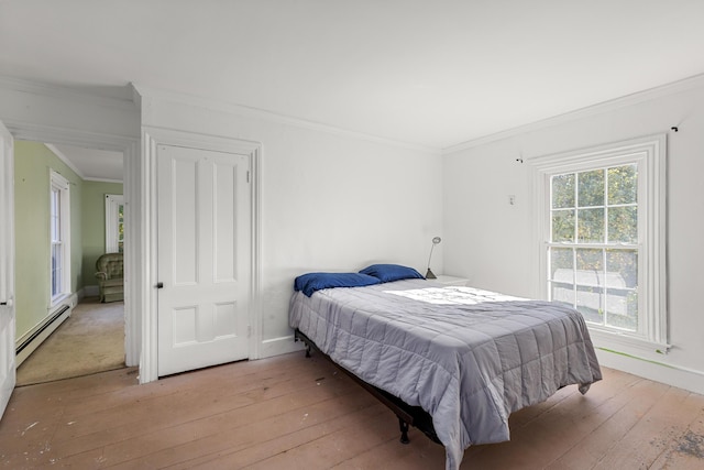 40 Mountain St, Camden, ME 04843 - bedroom featuring a baseboard heating unit, light wood finished floors, baseboards, and ornamental molding