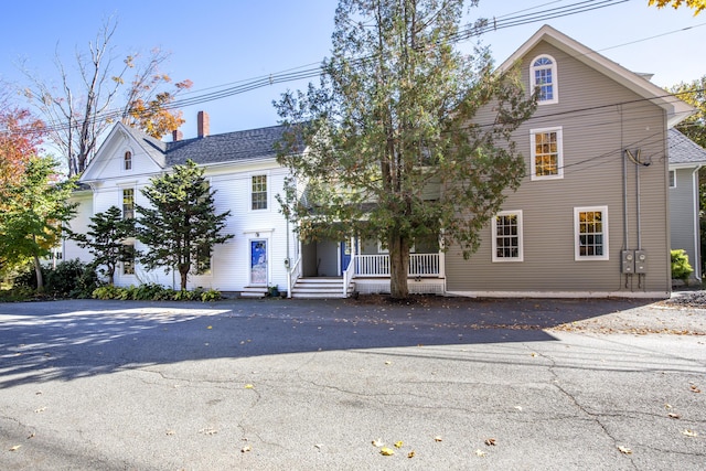 40 Mountain St, Camden, ME 04843 - view of front of home with a chimney and a porch