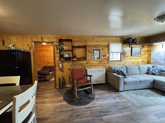 448 N Rd, Medford, ME 04463 - living area with radiator, wood finished floors, and wooden walls