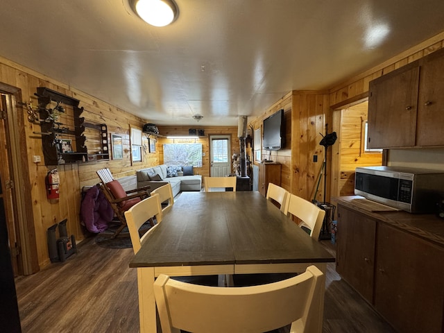 448 N Rd, Medford, ME 04463 - dining space featuring dark wood finished floors and wooden walls
