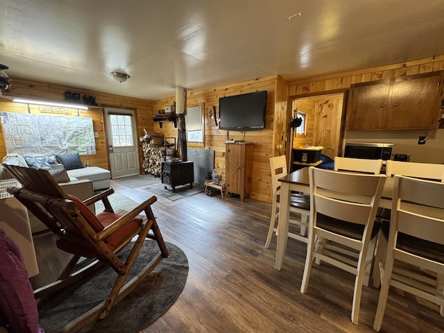 448 N Rd, Medford, ME 04463 - living room with wood finished floors, wood walls, and a wood stove