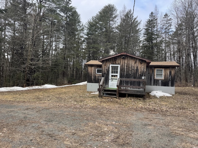 448 N Rd, Medford, ME 04463 - view of front facade featuring a wooded view and a deck