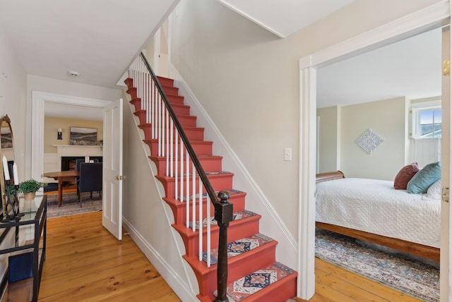 stairway featuring wood-type flooring