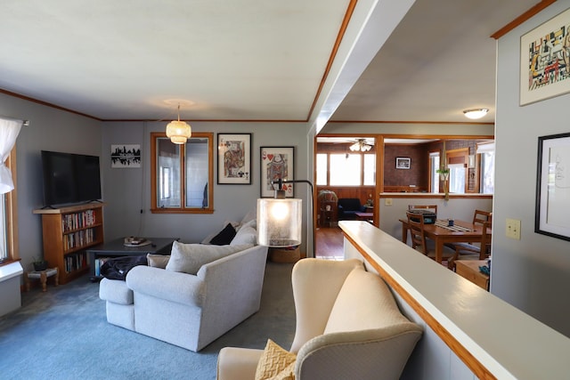 living area featuring carpet and a ceiling fan