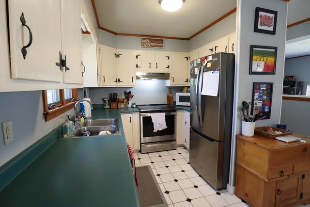 kitchen featuring stainless steel appliances, a sink, light floors, under cabinet range hood, and ornamental molding