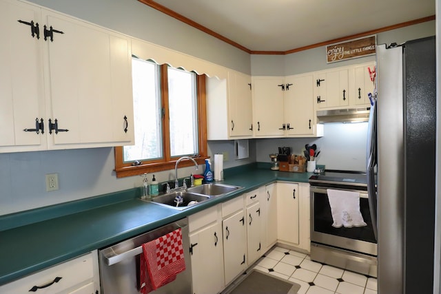 kitchen featuring white cabinets, a sink, dark countertops, under cabinet range hood, and appliances with stainless steel finishes