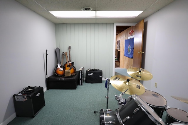 miscellaneous room with carpet, visible vents, and a paneled ceiling