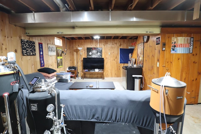 bedroom featuring wooden walls