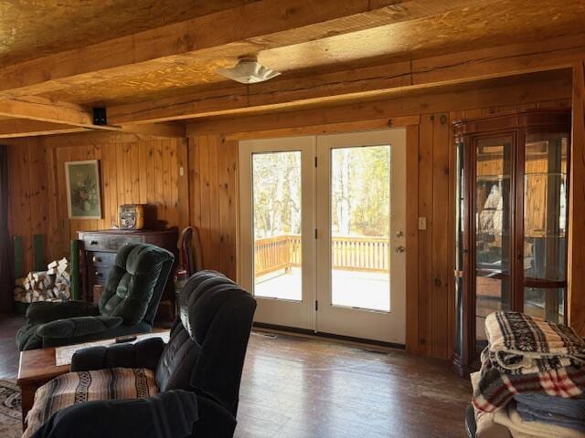 49 Pequawket Trl, Baldwin, ME 04024 - living area featuring wood walls, wood finished floors, and beam ceiling