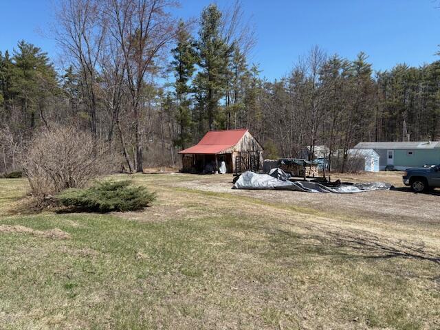 49 Pequawket Trl, Baldwin, ME 04024 - view of yard featuring a forest view