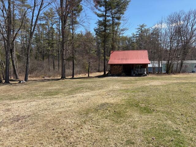 49 Pequawket Trl, Baldwin, ME 04024 - view of yard featuring an outdoor structure