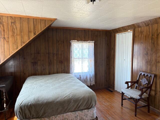 49 Pequawket Trl, Baldwin, ME 04024 - bedroom featuring wooden walls and wood finished floors