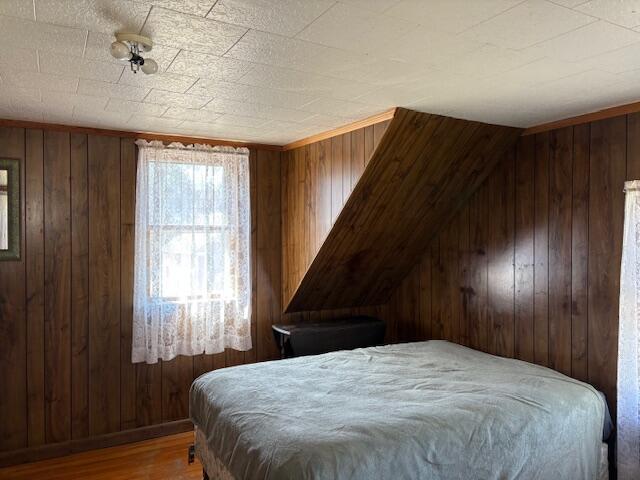 49 Pequawket Trl, Baldwin, ME 04024 - bedroom with wood finished floors and wood walls