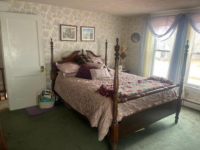 bedroom with wallpapered walls and carpet